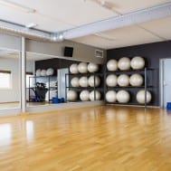 Empty pilates studio with equipment