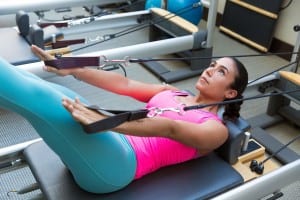 Woman on a Pilates Reformer