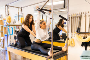How Pilates Moves Stack to Create Your Workout